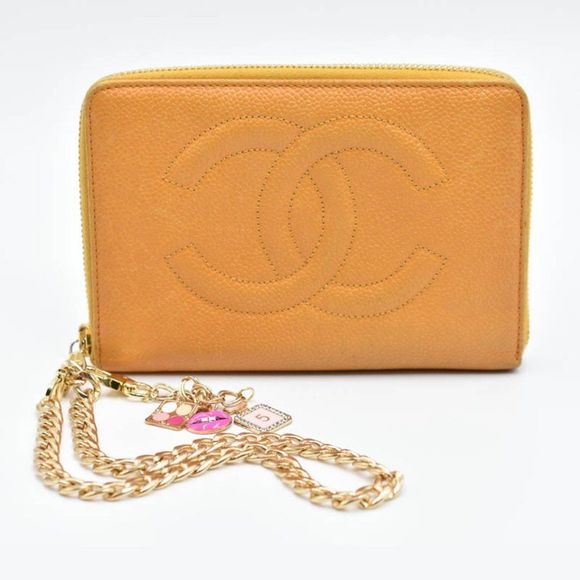 CHANEL Handbags - CHANEL CC Caviar Zip Around Wristlet/Clutch in Orange Tone